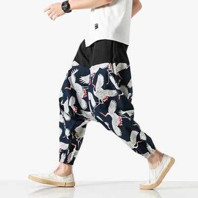 These japanese style mens pants are printed with Tsuru cranes on the fabric. They are wide-legged, sarouel-style Japanese pants.