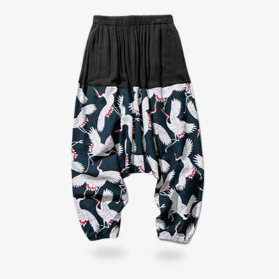 These japanese style pants men are made from a wide cut Japanese sarouel. The fabric is printed with the Tsuru crane symbol. The fabric of the flowing Japanese Pants is comfortable and light