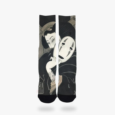 A pair of Japanese style socks with a print of a Japanese geisha holding a mask of the faceless s in Spirited Away anime movie
