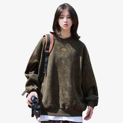 A girls is dressed with a Japanese style sweatshirt in a vibrant green color, made from a blend of Spandex and Polyester for a comfortable and stylish fit