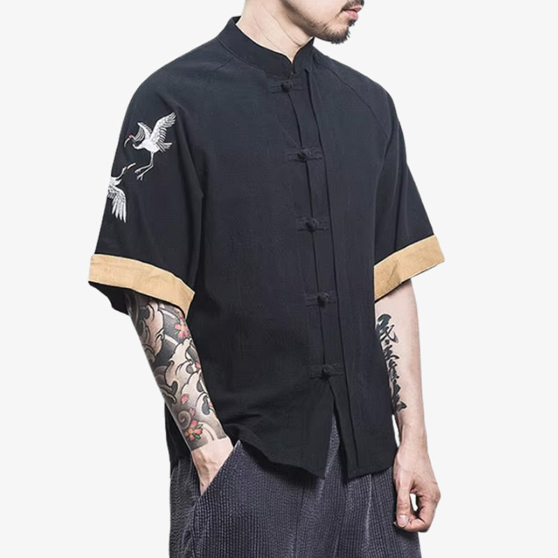 a man is dressed with a black Japanese t-shirt with minimalist or culturally inspired graphics, ideal for everyday wear rooted in Japanese design.