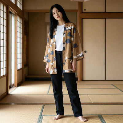 Woman wearing a haori yukata in a washitsu room with tatami and shoji screens