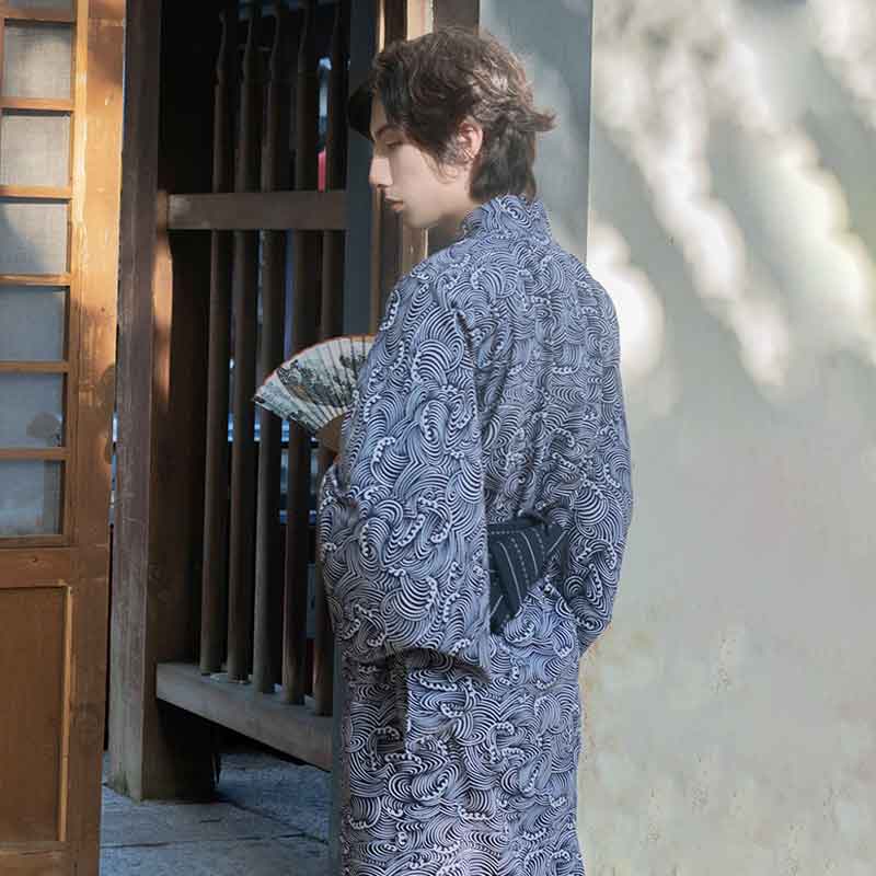 A man wears a japanese wave Yukata and and black obi belt at his back