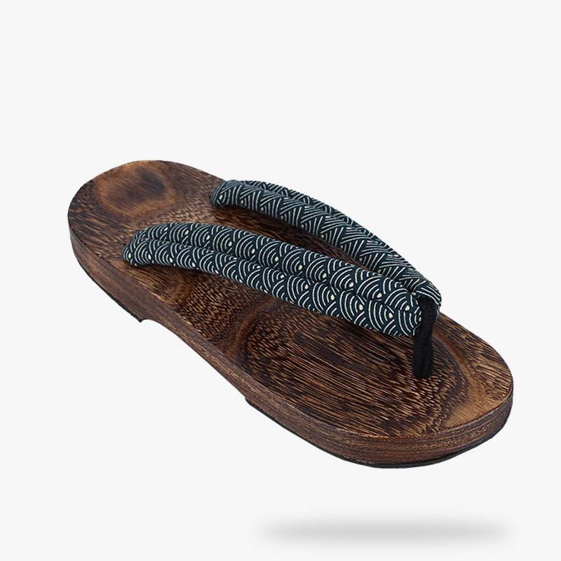 Market display of Japanese wooden sandals for sale, variety of sizes.