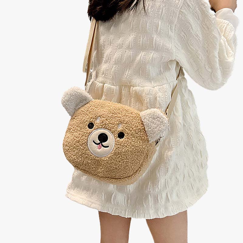 A woman in a skirt is carrying a Kawaii Crossbody Bag in the shape of a teddy bear's head. The bag's material is soft and Khaki-colored. The Kawaii Bag is as functional as it is cute, adorned with adorable motifs that will brighten your day