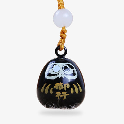 The Daruma keychain is a classic Japanese charm symbolizing perseverance and luck, often used as a motivational accessory