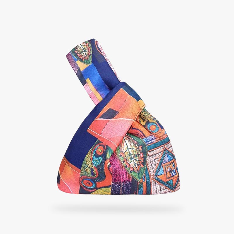 Carry a piece of traditional Japanese culture with our Kimono bag, elegantly crafted from authentic kimono fabric, ideal for those who appreciate both style and heritage. This Japanese knot bag is a tote bag with brightly colored prints on cotton.