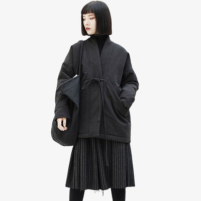 This girl is dressed with black Kimono Coat For womens. The Japanese coat is a kimono jacket with a belt around the waist. The cotton fabric is thick and