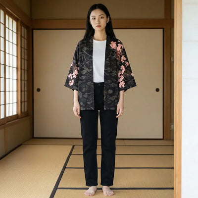 Woman wearing a dragon kimono in a washitsu room with tatami and shoji screens