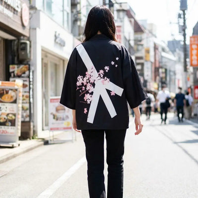 Woman seen from behind wearing a mens floral kimono in a Harajuku street