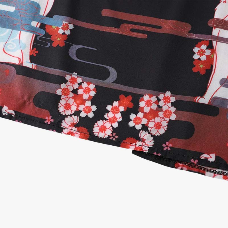 The black kimono kitsune is printed with white sakura flowers