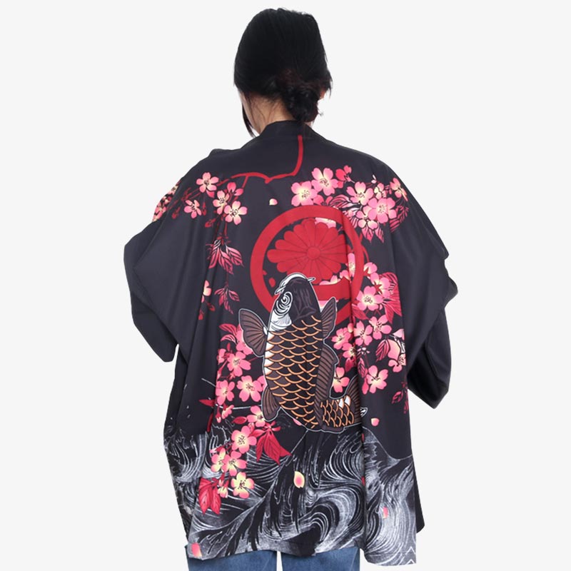 The kimono koi fish blends traditional Japanese art with modern fashion, showcasing stunning koi fish motifs. The women kimono jacket is black with sakura printed and japanese fish jumping