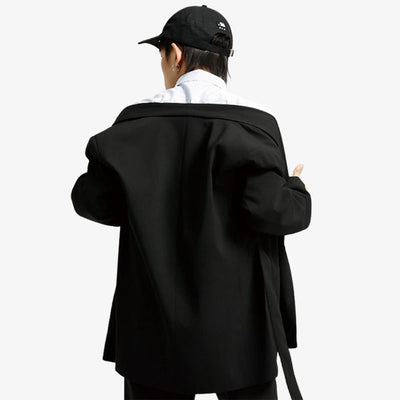 A man from the back takes off his Japanese kimono style jacket