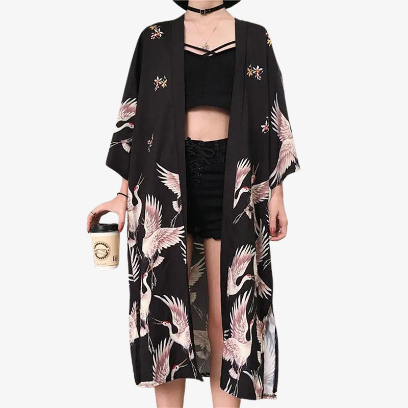 Indulge in the luxurious feel of black kimono style robes for women, designed to offer elegance and comfort for any occasion. Japanese birds Tsuru printed on cotton material