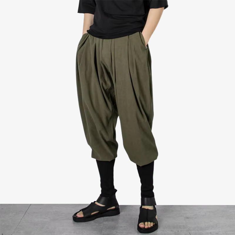 Loose Japanese pants designed for comfort and style, reflecting relaxed Japanese fashion aesthetics. The man is also dressed with fashion japanese sandals and a black harjuku shirt