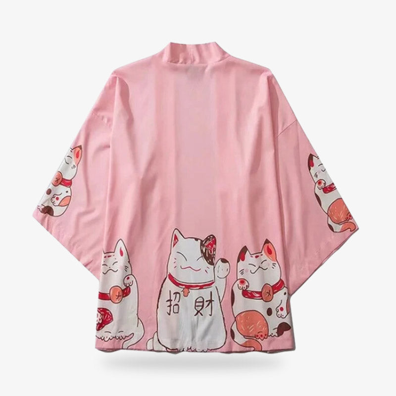 The lucky cat kimono is adorned with charming maneki-neko designs, symbolizing good fortune and prosperity. The kimono jacket is pink with kawaii prints