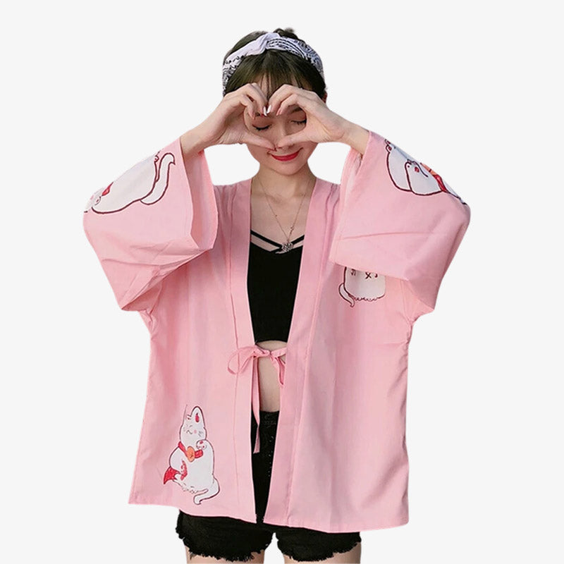 This cute kimono is in a charming pink color, adorned with delightful cat prints that add a playful touch to traditional Japanese fashion