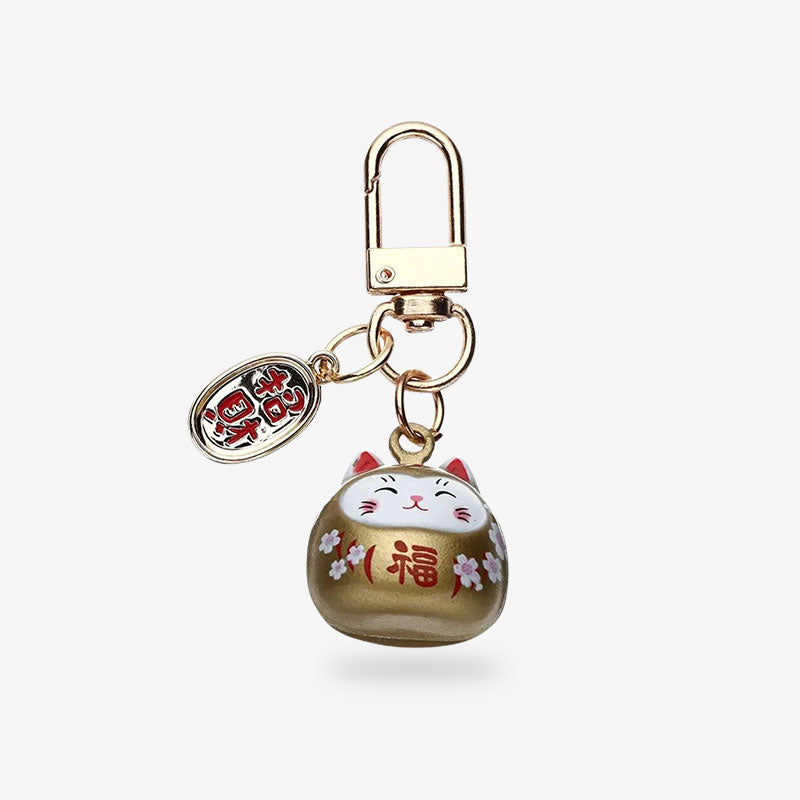 To attract good luck, here's a ceramic maneki-neko-lucky cat keychain. Gold color for this traditional japanese cat accessory for kawaii lovers