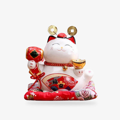 this maneko neko lucky cat statue is a white japanese lucky cat. It is made of ceramic. He's holding a lucky mallet in his paw. Hand-painted in red with a Japanese fan motif.