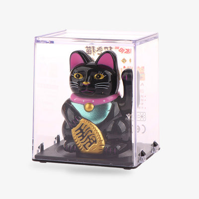 A Maneki neko solar powered cat that moves its arm using solar energy. The lucky cat is made of PU. The black colour of the Japanese cat also scares away evil spirits. The Japanese maneki is a decorative object that brings good luck and wealth.