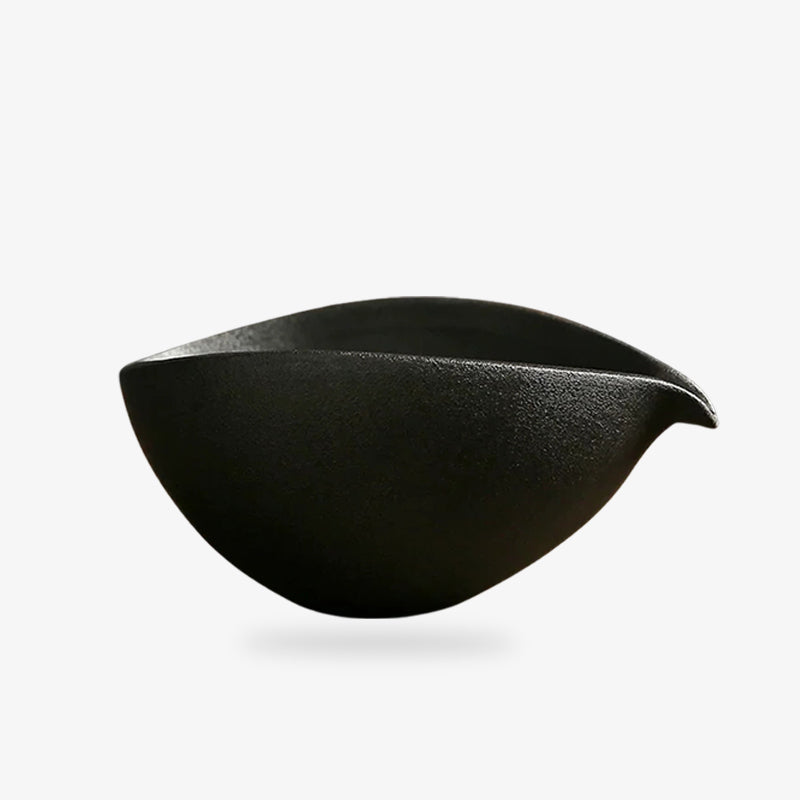 This is a black japanese Matcha tea bowl crafted in ceramic, designed for preparing and enjoying authentic Japanese tea