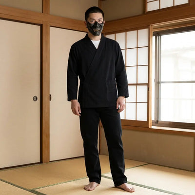 Man wearing a japanese samue in a traditional Japanese washitsu room, front view