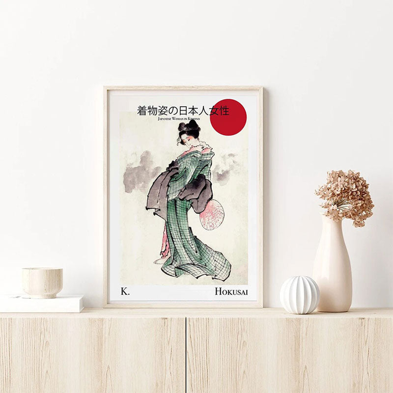 This modern geisha painting is a reproduction by Hokusai. This Japanese decorative object is positioned on a wooden cabinet.