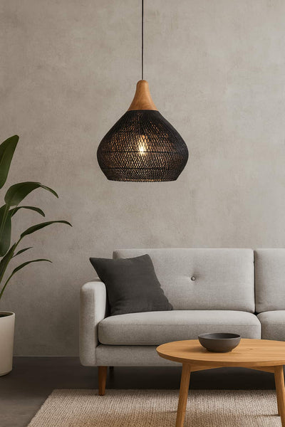 Modern Japandi lamp in a living room with a gray sofa, wooden coffee table, and pendant light.