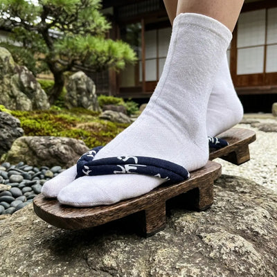 Close-up of navy hanao strap with white characters on Sandal Traditional Japanese geta