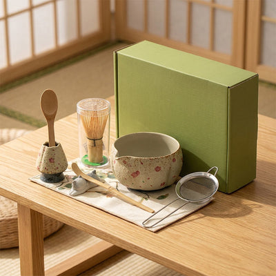 A beautiful and nice matcha set​ with a green box on a wooden table