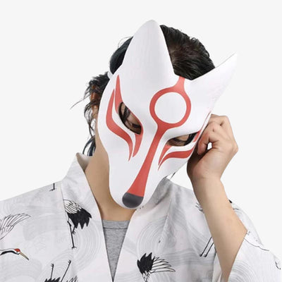 A man wears a okami face mask inspired by japanese symbole goddess Amaterasu. He also wears a white kimono