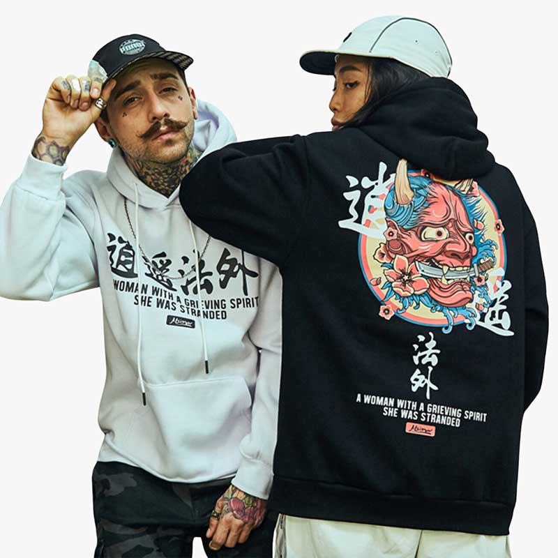 a man and a girl are dressed with Japanese oni hoodie. Japanese Oni design printed are drawn with kanji and Japanese demon face
