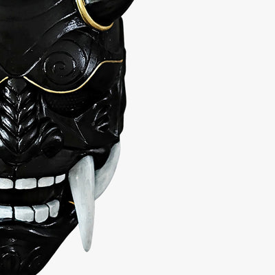 This black oni mask demon is a handcrafted artifact, made from high-quality materials, hand-painted and sculpted with horns and sharp white teeth to depict the legendary Japanese demon.