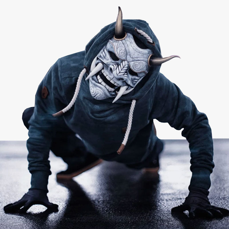 The oni mask traditional is a handcrafted masterpiece, made from high-quality fiberglass and wood, featuring hand-painted and sculpted details with horns and sharp teeth, each mask uniquely reflecting the legends and myths of Japan