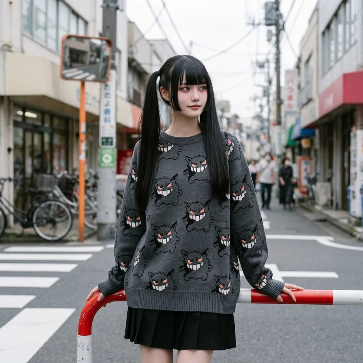 Oversized charcoal gray crewneck sweater with dropped raglan shoulders and ribbed neckline featuring ghost face knit pattern