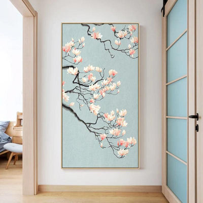 In an apartment, a large painting of cherry blossom trees hangs on the wall. Sakura flowers are white