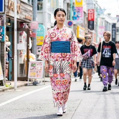 Back view of the pink floral kimono dress showing the obi-style waist and flowing hem