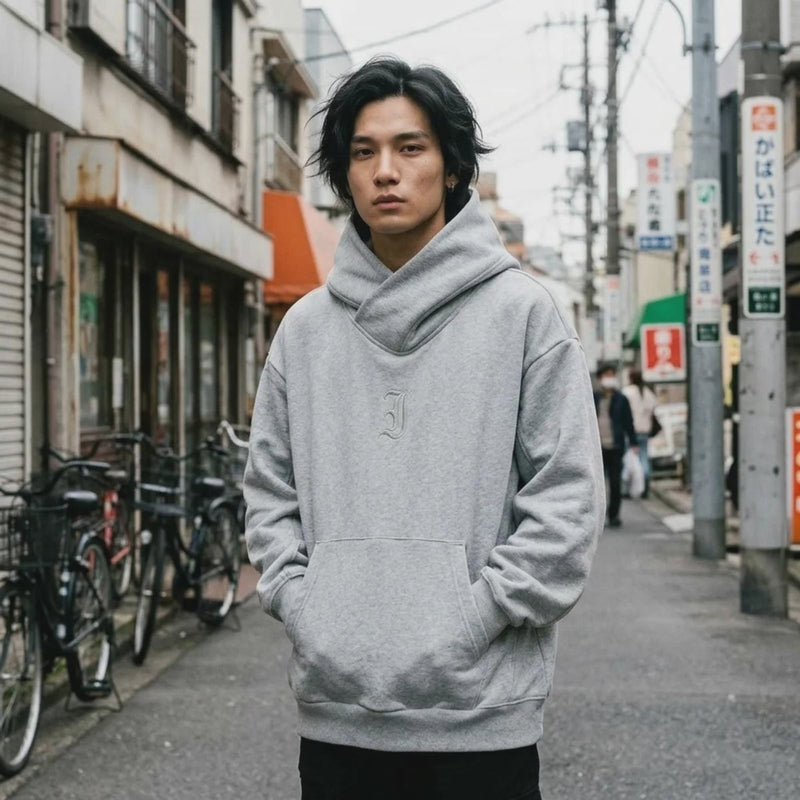 Video showing the oversized grey Harajuku hoodie worn with its cowl hood scrunched around the neck