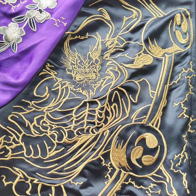 The Raijin Fujin souvenir jacket features the iconic gods of thunder and wind, offering a stunning representation of Japanese mythology