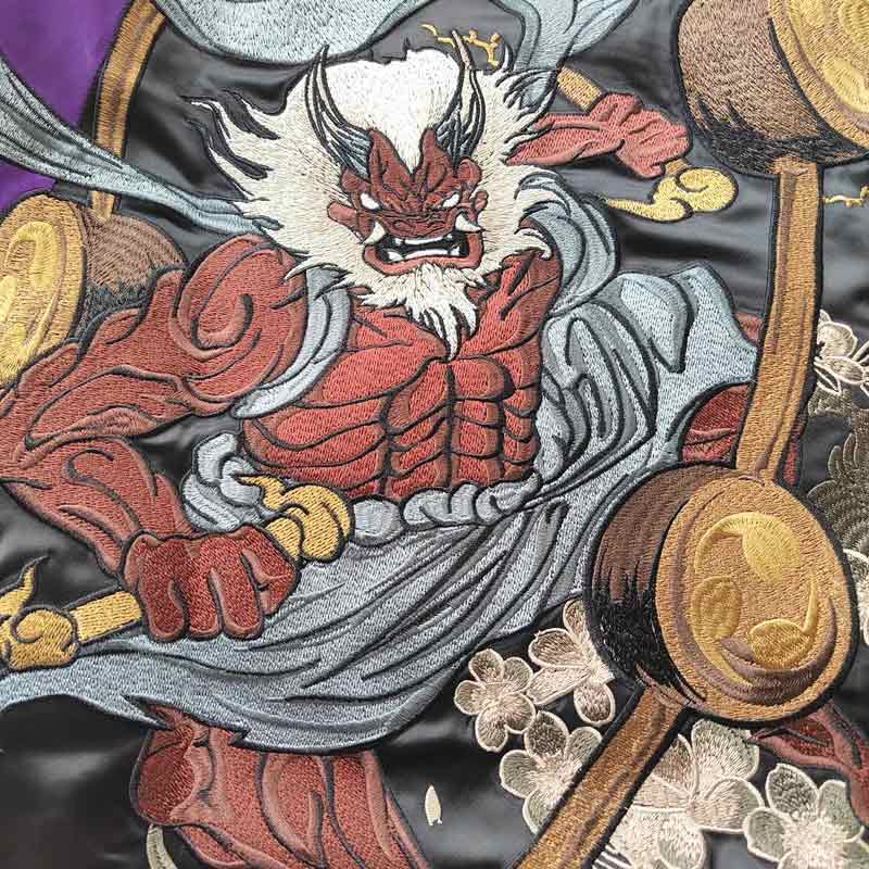 The raijin pattern sukajan highlights intricate designs of the thunder god, symbolizing strength and energy in Japanese folklore