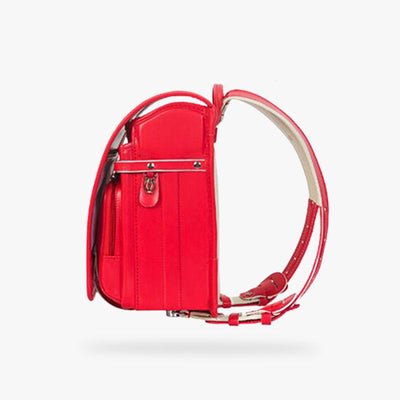 This red randoseru japanese backpack is made of leather and has shoulder straps. It's a Japanese bag with several pockets.  Durable and practical satchel