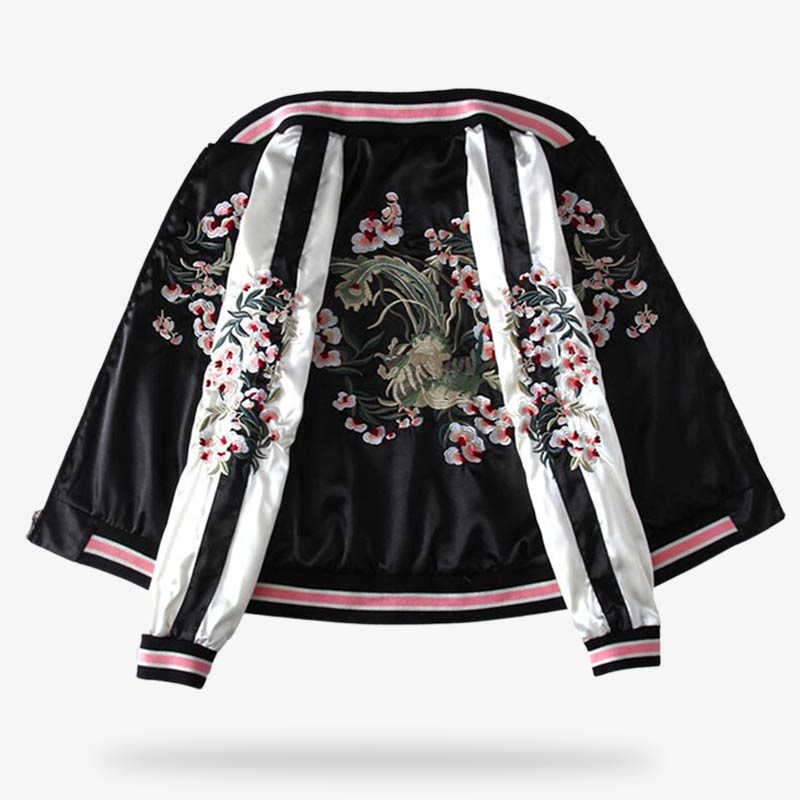 A black and white reversible signature souvenir jacket with floral embroidery on the sleeves and back of the sukajan coat.