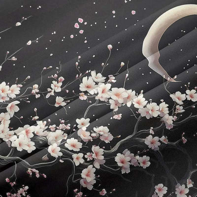 this black kimono fabric is printed with white sakura blossom pattern and a moon