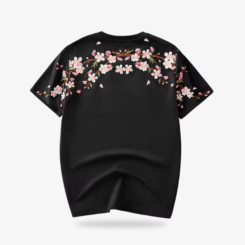 Black t-shirt with cherry blossom floral design on a white background
