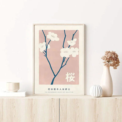 This wooden frame is a Japanese sakura painting. The canvas depicts a sakura painting of a japanese cherry blossoms. The sakura poster is on a shelve on a minimalist home decor