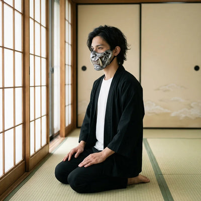 Samurai oni mask seen in profile, the carved cheek and ivory fang, worn while kneeling on tatami