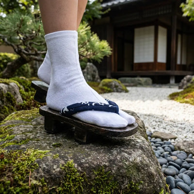 Side profile of Sandal Japanese Man showing crane and cloud pattern on indigo strap