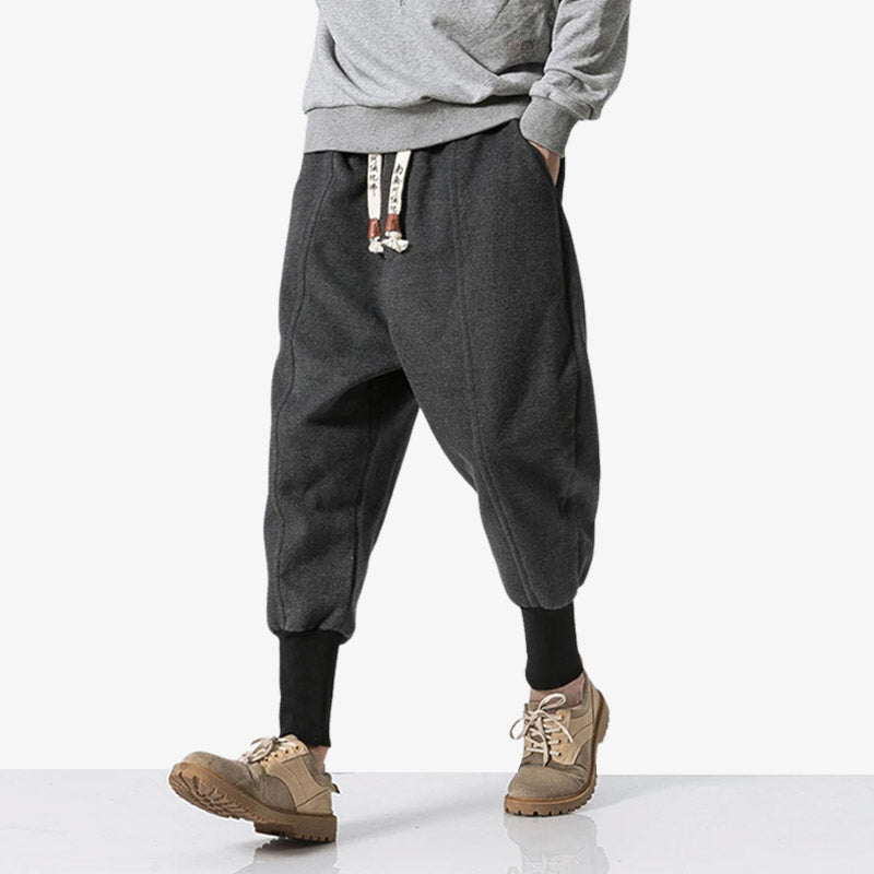 A man walks in shinobi pants that are tight around his calves