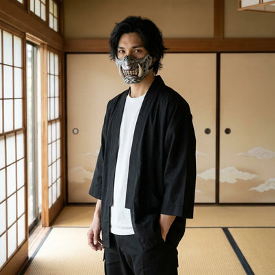 Silver oni half mask with ivory fangs worn in a Japanese tatami room