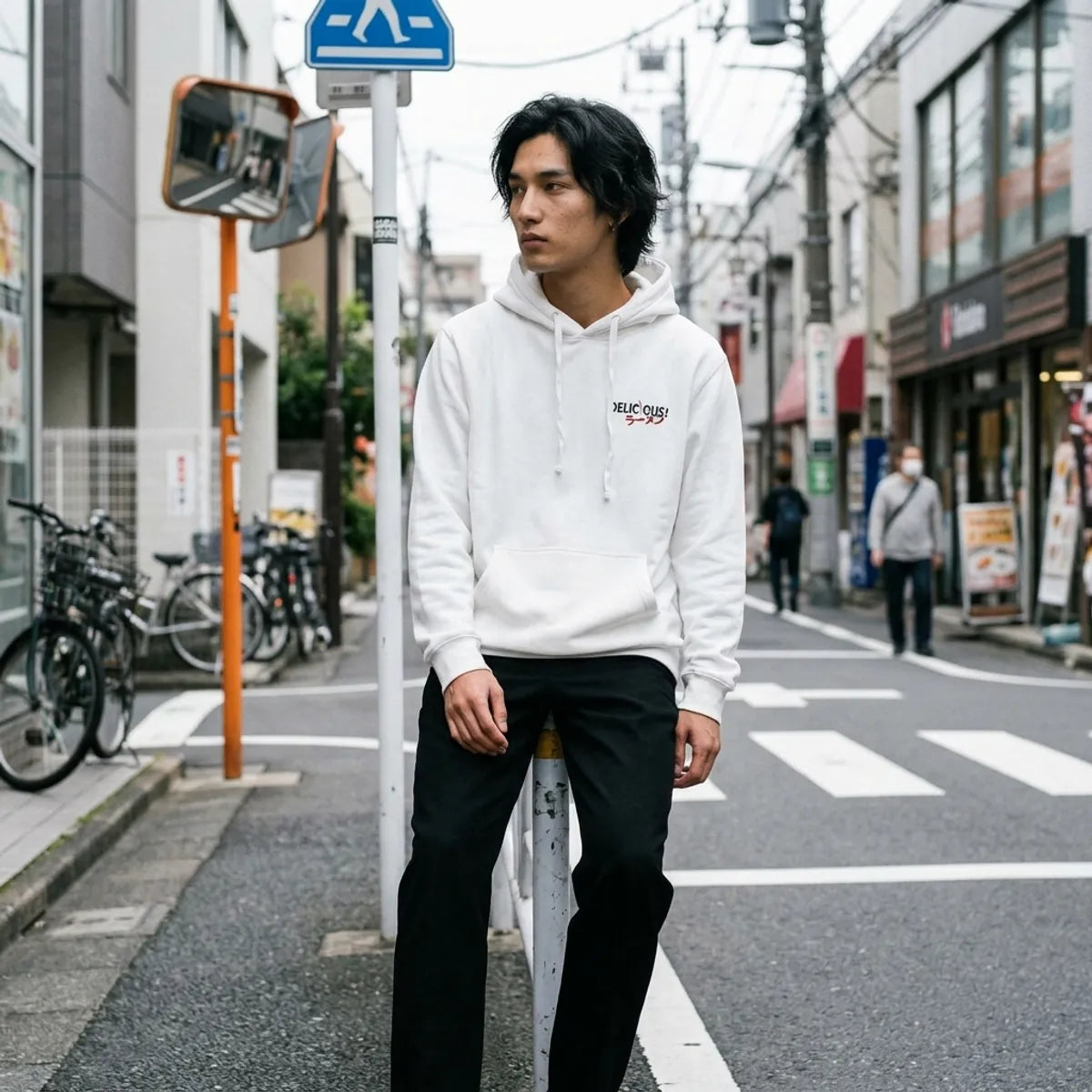 White Tokyo Hoodie laid flat showing the ramen chest print and kangaroo pocket